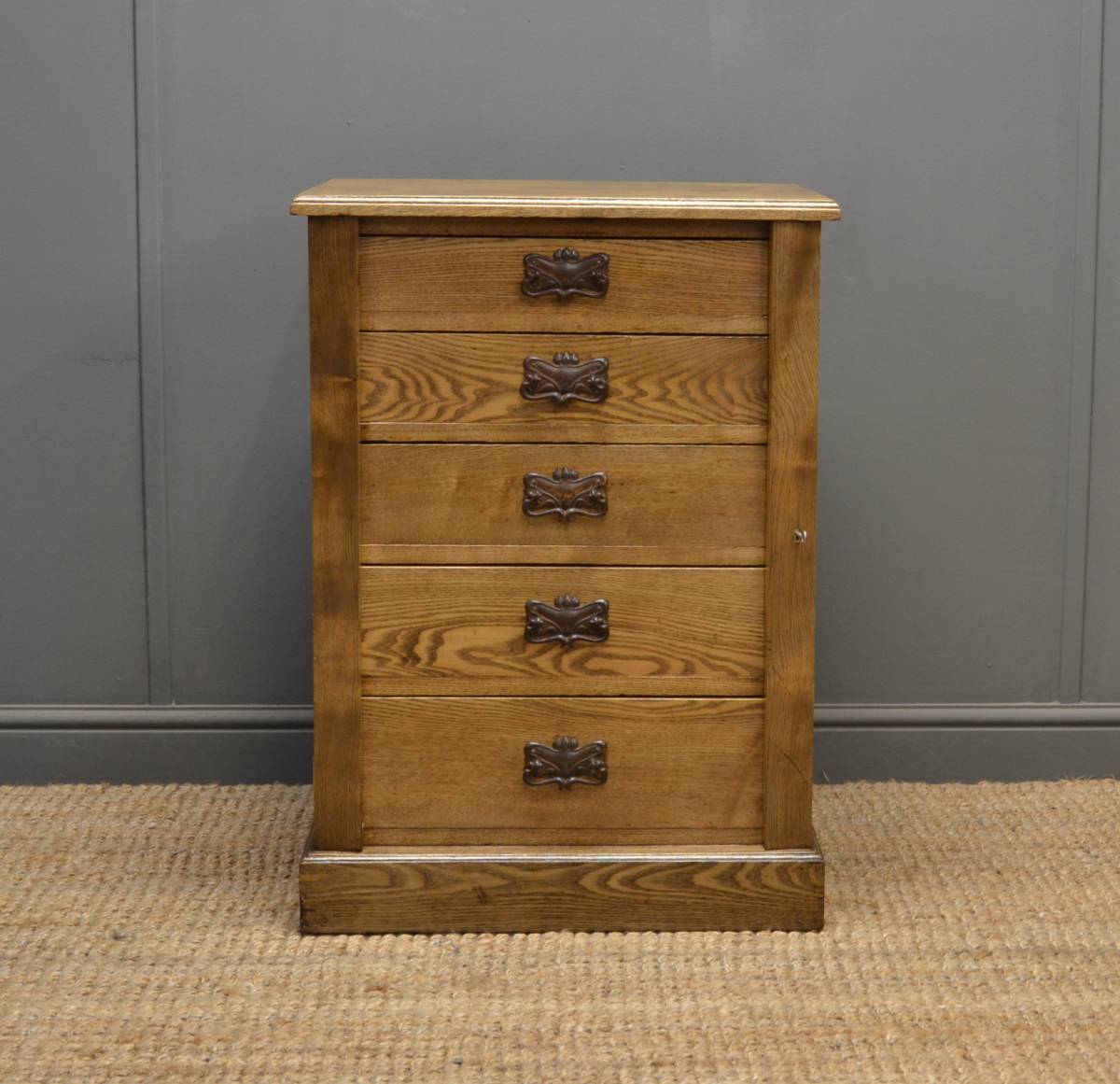 Small Ash Wellington chest with Art Nouveau handles.