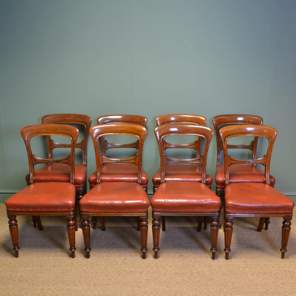 Country House Set of Eight Victorian Oak Balloon Back Antique Dining Chairs by James Winter & Sons.