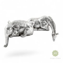 Silver Giraffe & Elephant Peering Over Figures
